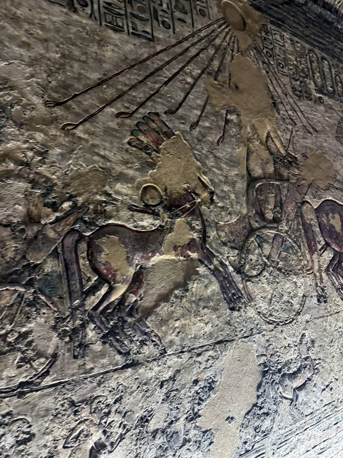 Amarna tomb relief of the Aten sun disc sending rays over the royal chariot