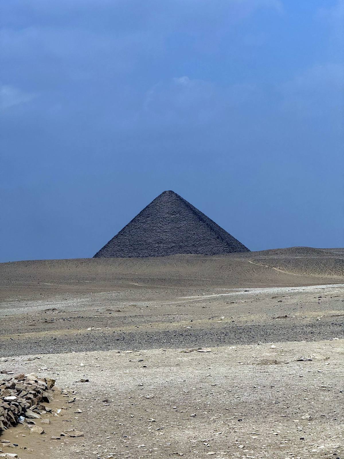 The Red Pyramid rising from the open desert at Dahshur