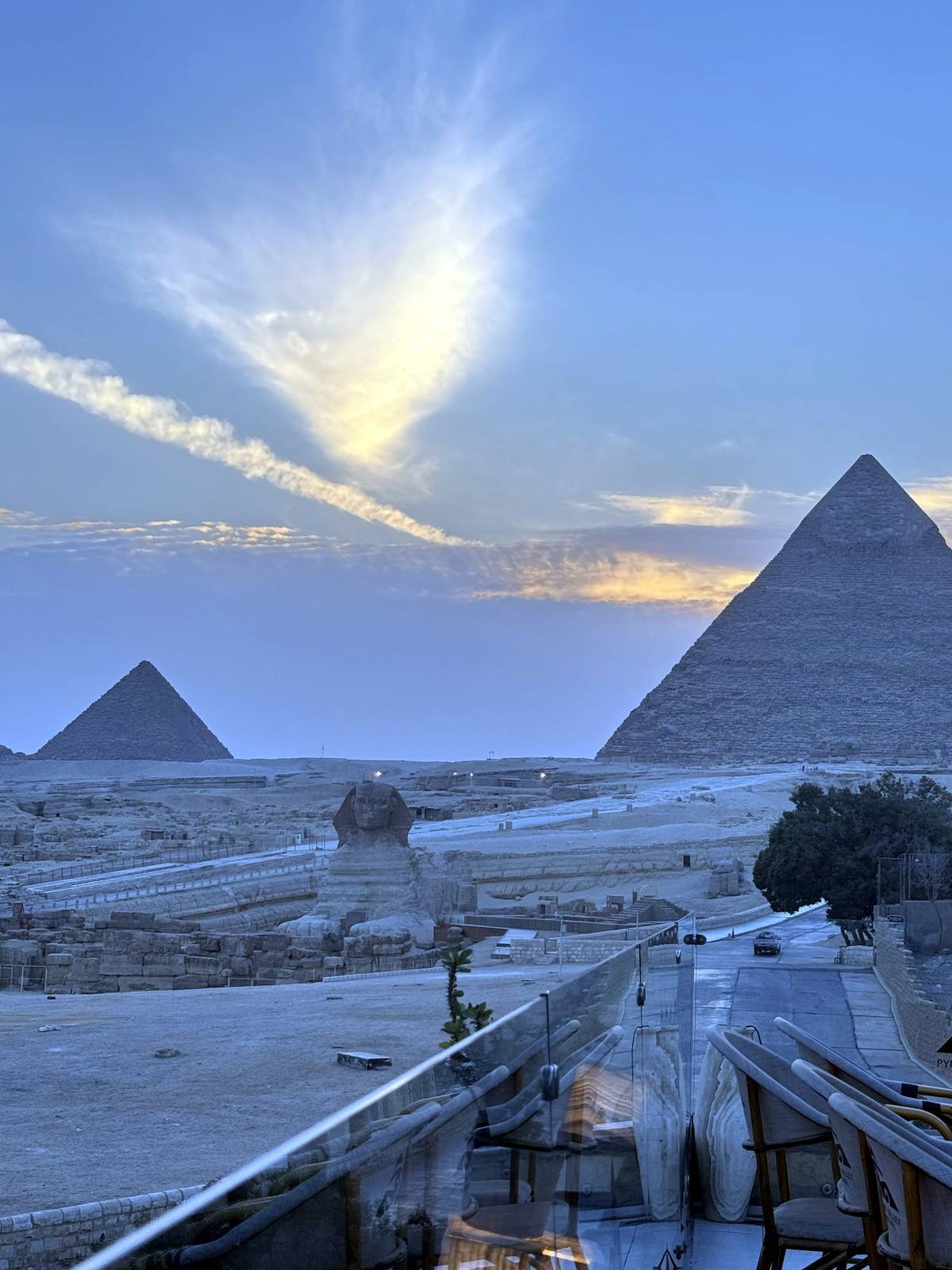 Khufu and Khafre pyramids at sunset seen from a Giza terrace