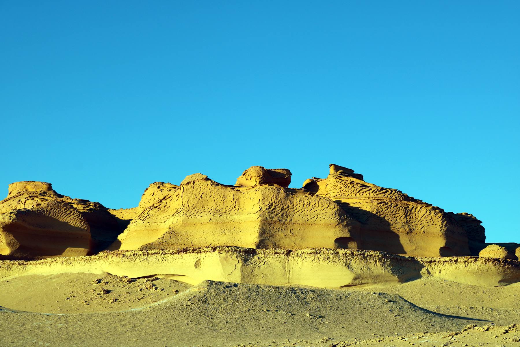 Golden sandstone formations of Wadi al-Hitan, the Valley of the Whales