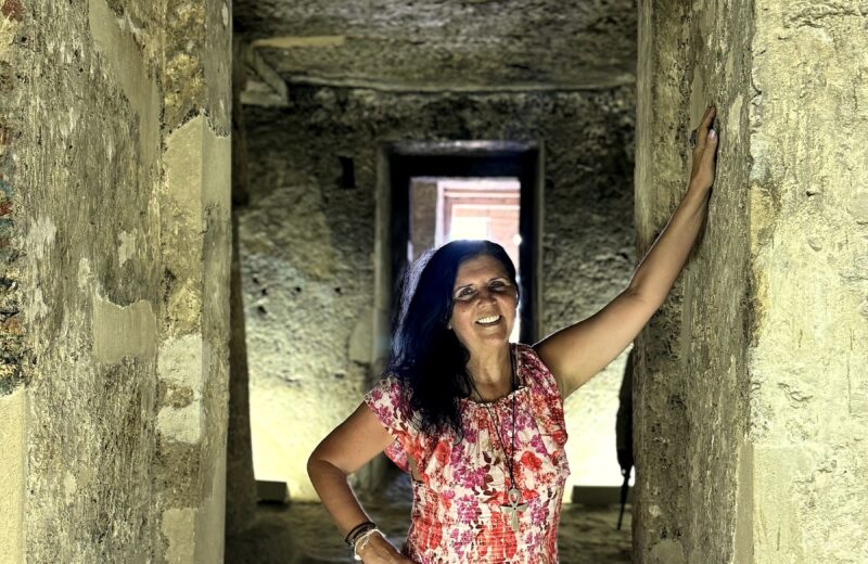 Kristina Mills standing in the ancient Tomb of Panehsy, Amarna